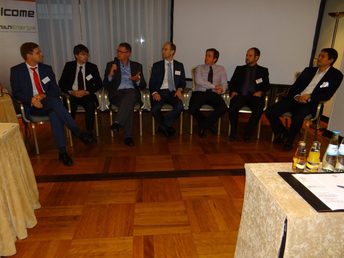 A panel discussion with a handheld microphone at a previous Zenith Group event